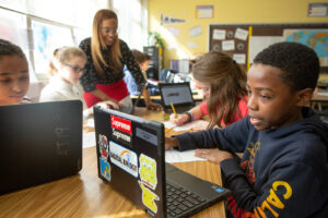 Students at Sutton Middle School use online research to answer questions during a lesson in history class.